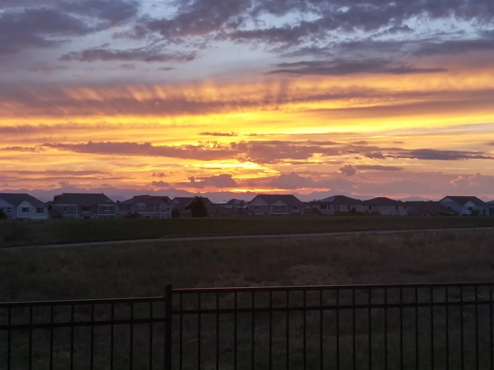 Sunset over homes in Green Valley Ranch